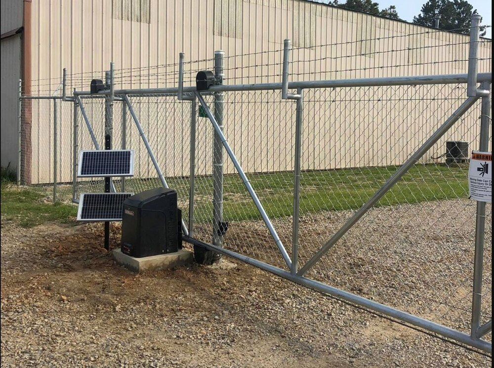 Completed chain-link gate with powered operator and safety equipment