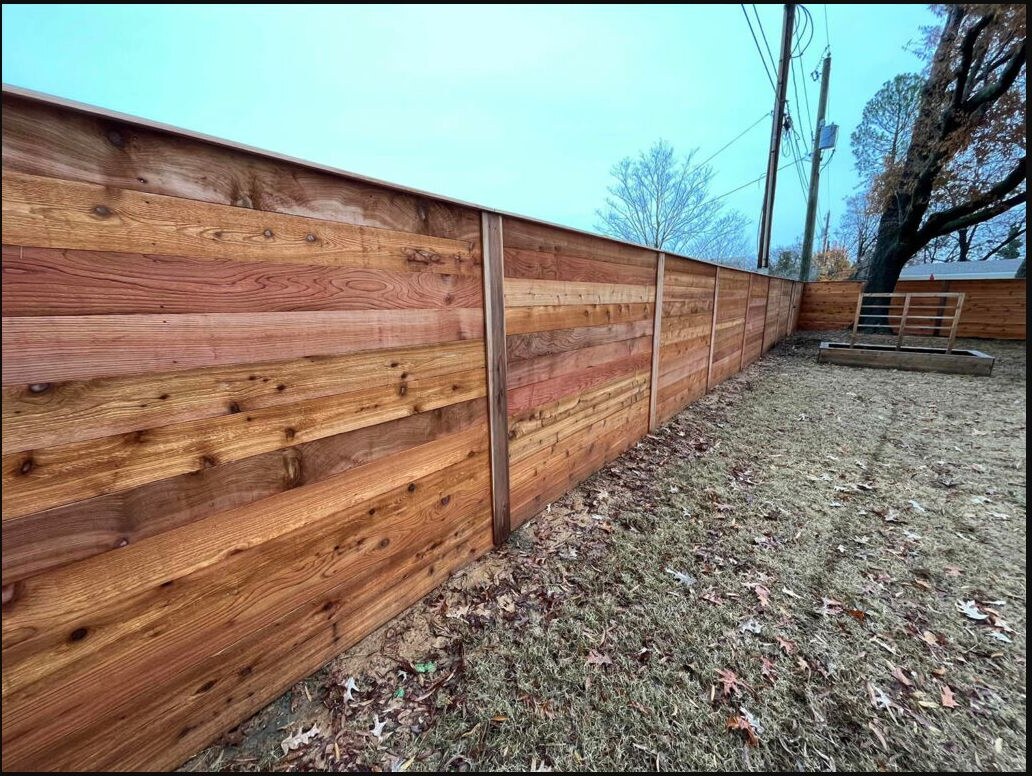Finished cedar privacy fence enclosing a backyard